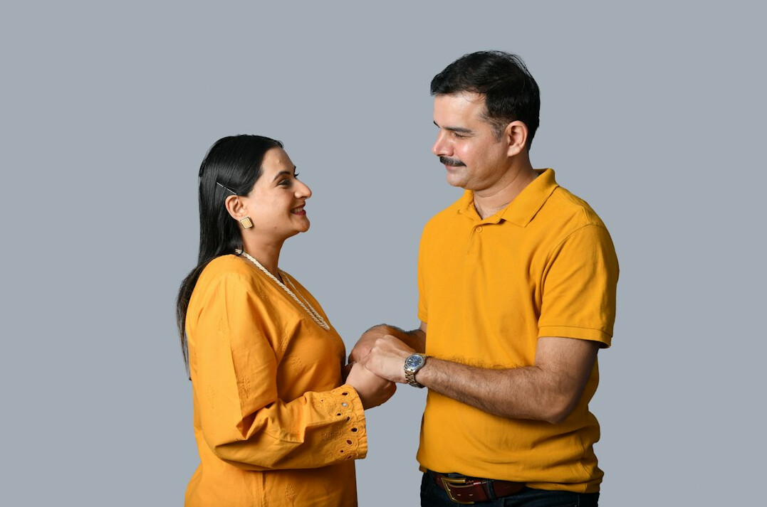 man and woman shaking hands after deal